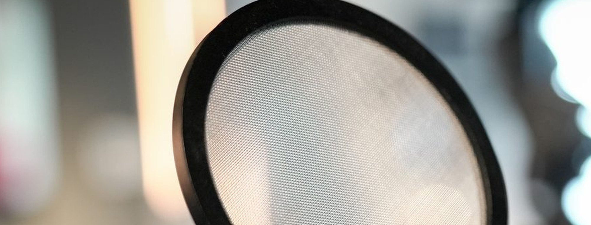 A condenser microphone and pop shield on the bench at MCX, close