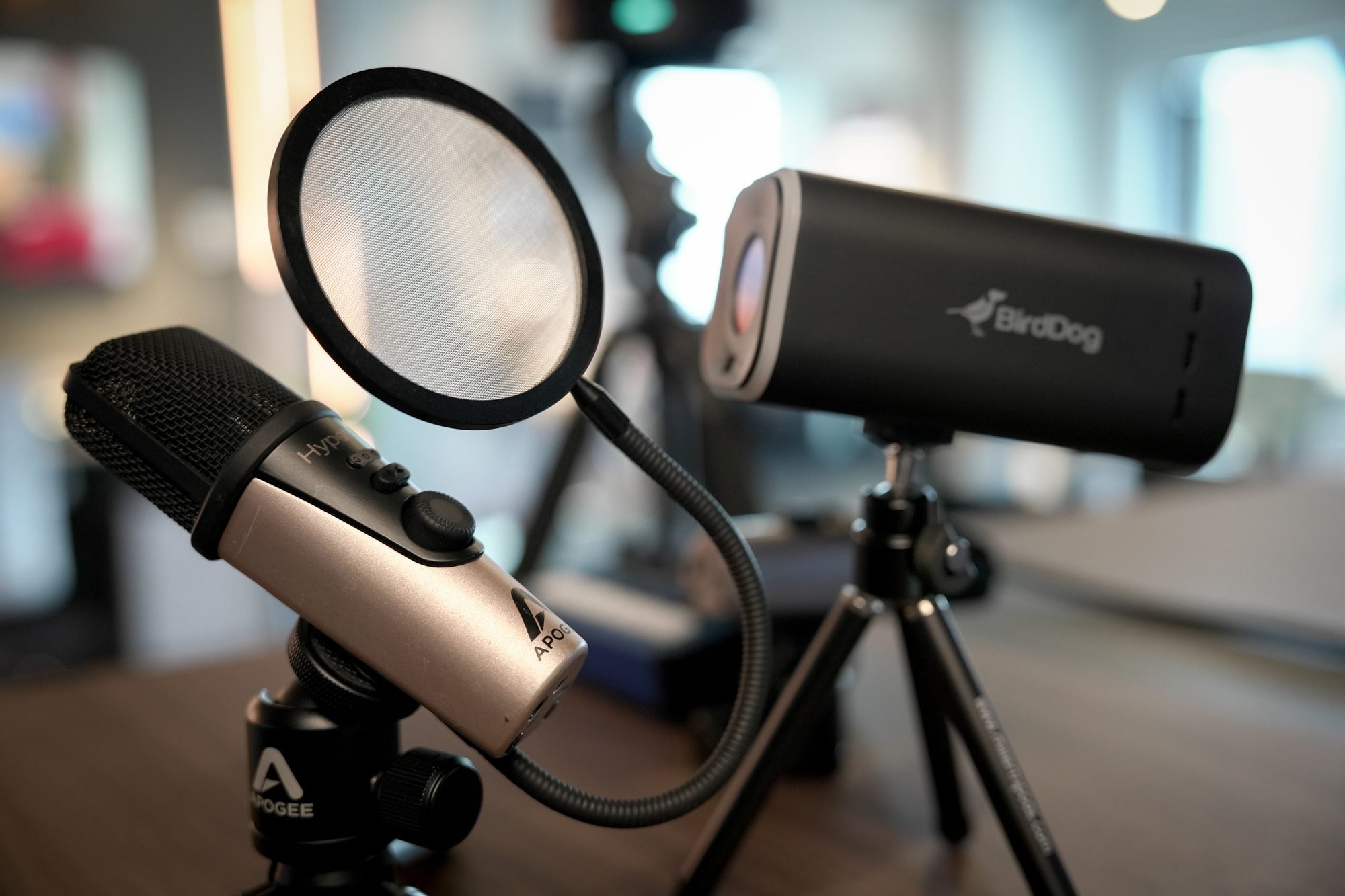 A podcast microphone and a BirdDog head at MCX