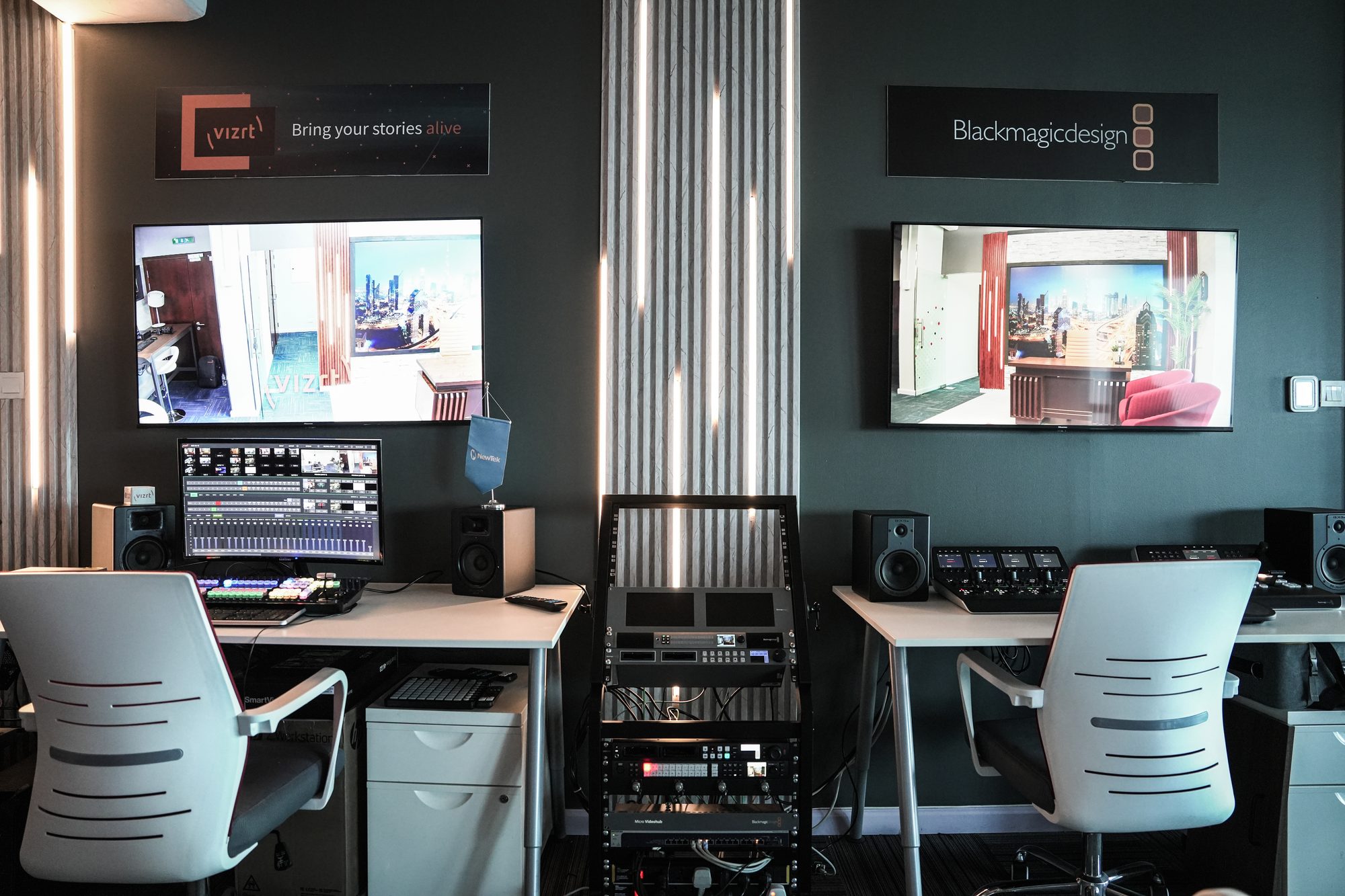 Two gallery positions at MCX, either side of the equipment rack that feeds them both