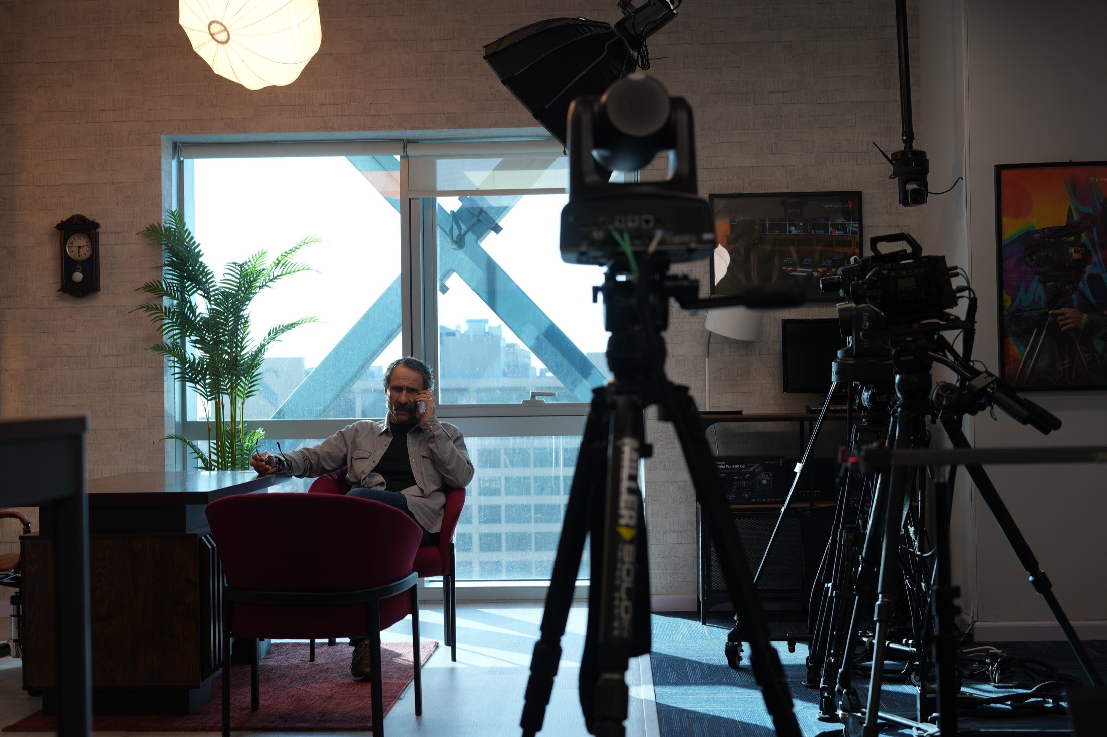 A guest seated on the MCX set with cameras rigged in front