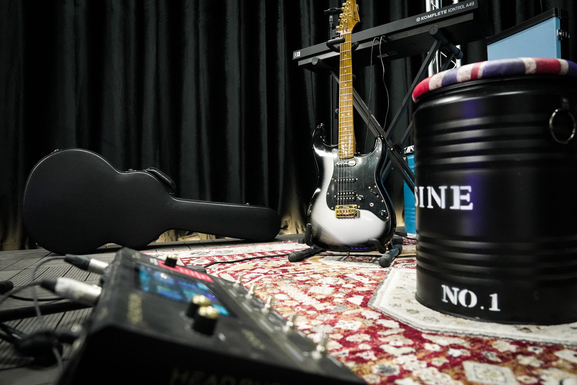 Guitars and a pedalboard on the MCX stage