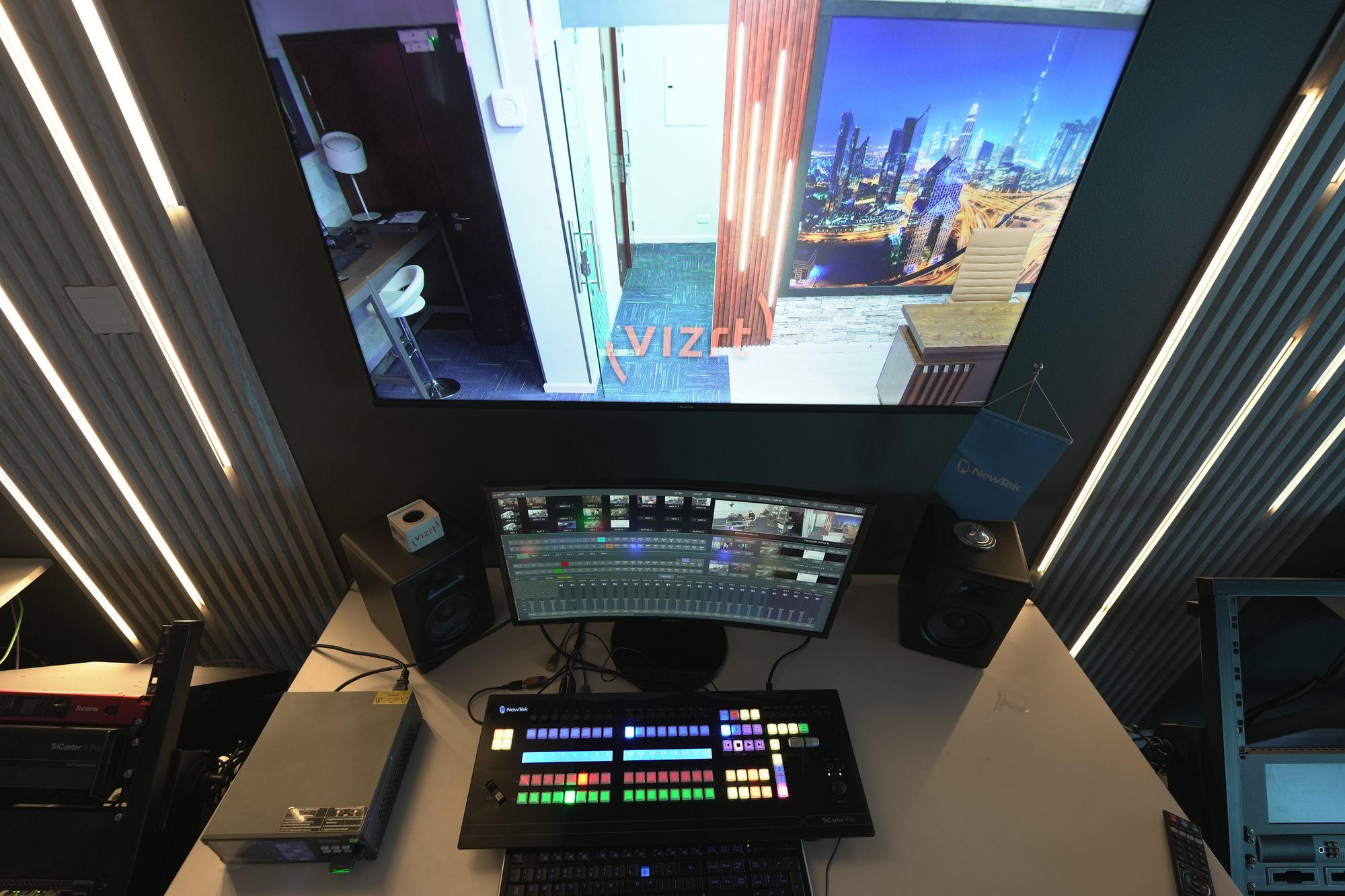 The control surface with a Vizrt graphics screen above it