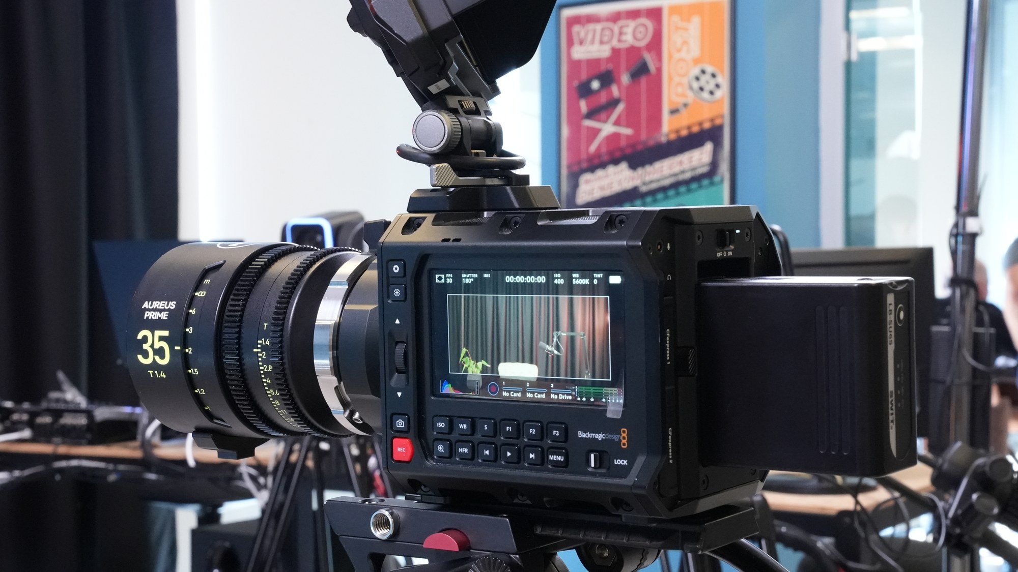 A Blackmagic cinema camera with a 35 mm cine prime, monitor showing timecode and scopes